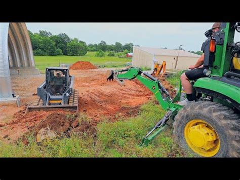 skid steer on hillside|Cutting Grade with the Skid Steer and Digging Out a Hill Side.